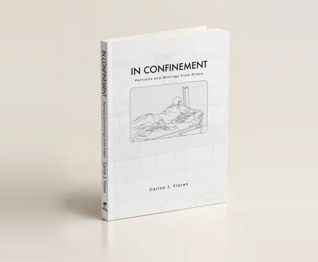 Three-quarter view of the paperback book In Confinement by Carlos J. Flores, featuring a black-and-white drawing of a man lying on a prison bunk against a background of prison fences and razor wire.